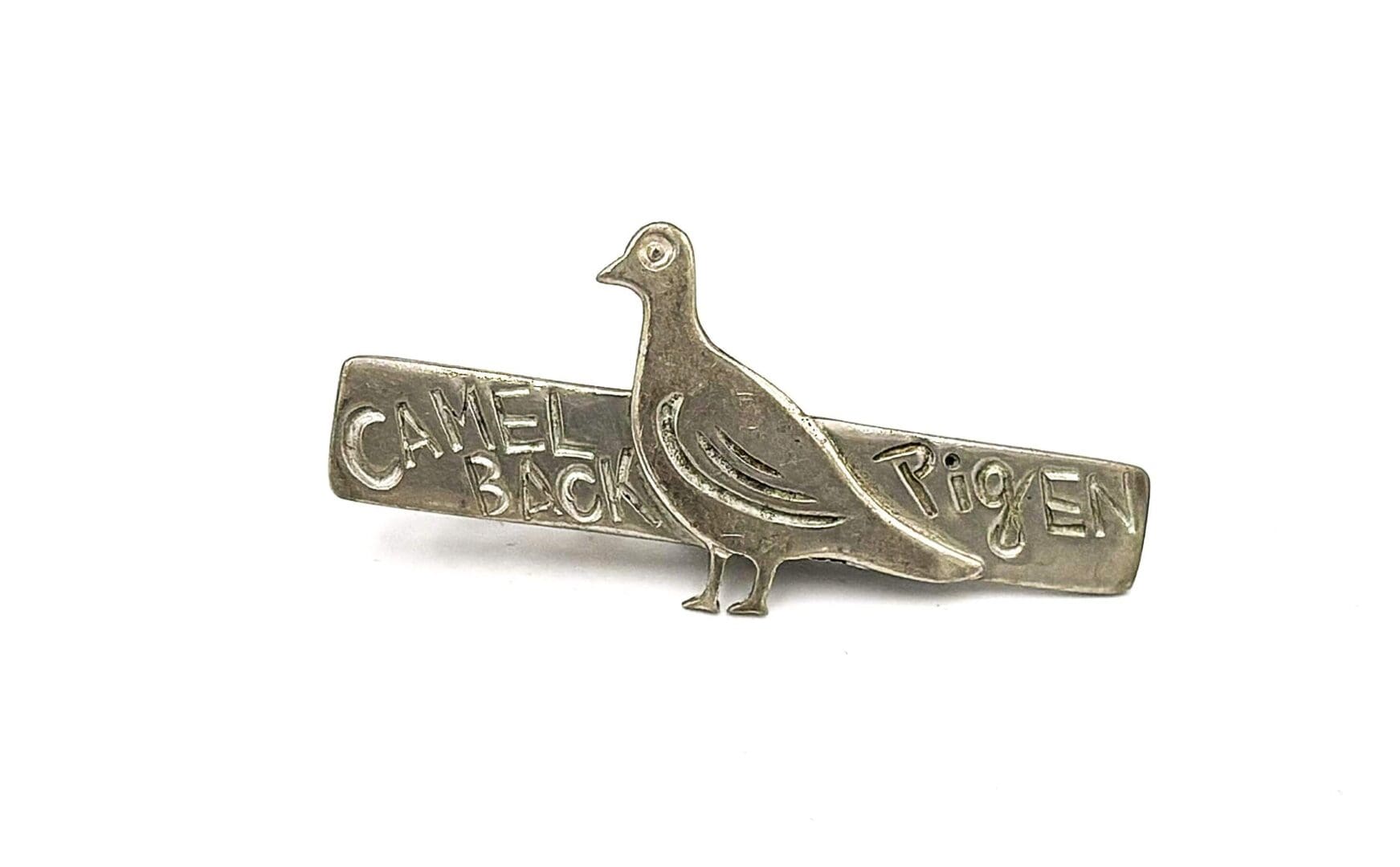 Metal pin featuring a pigeon design.