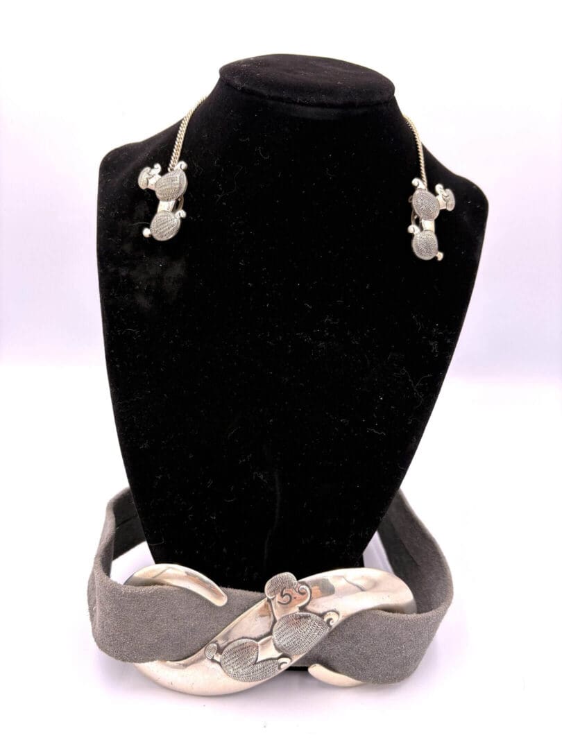 Silver jewelry set with necklace and bracelet.