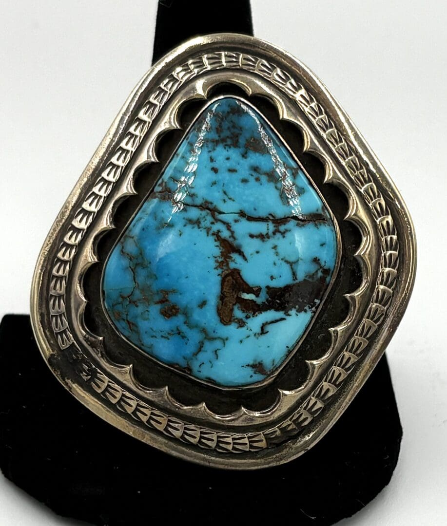 Silver ring with blue turquoise stone.