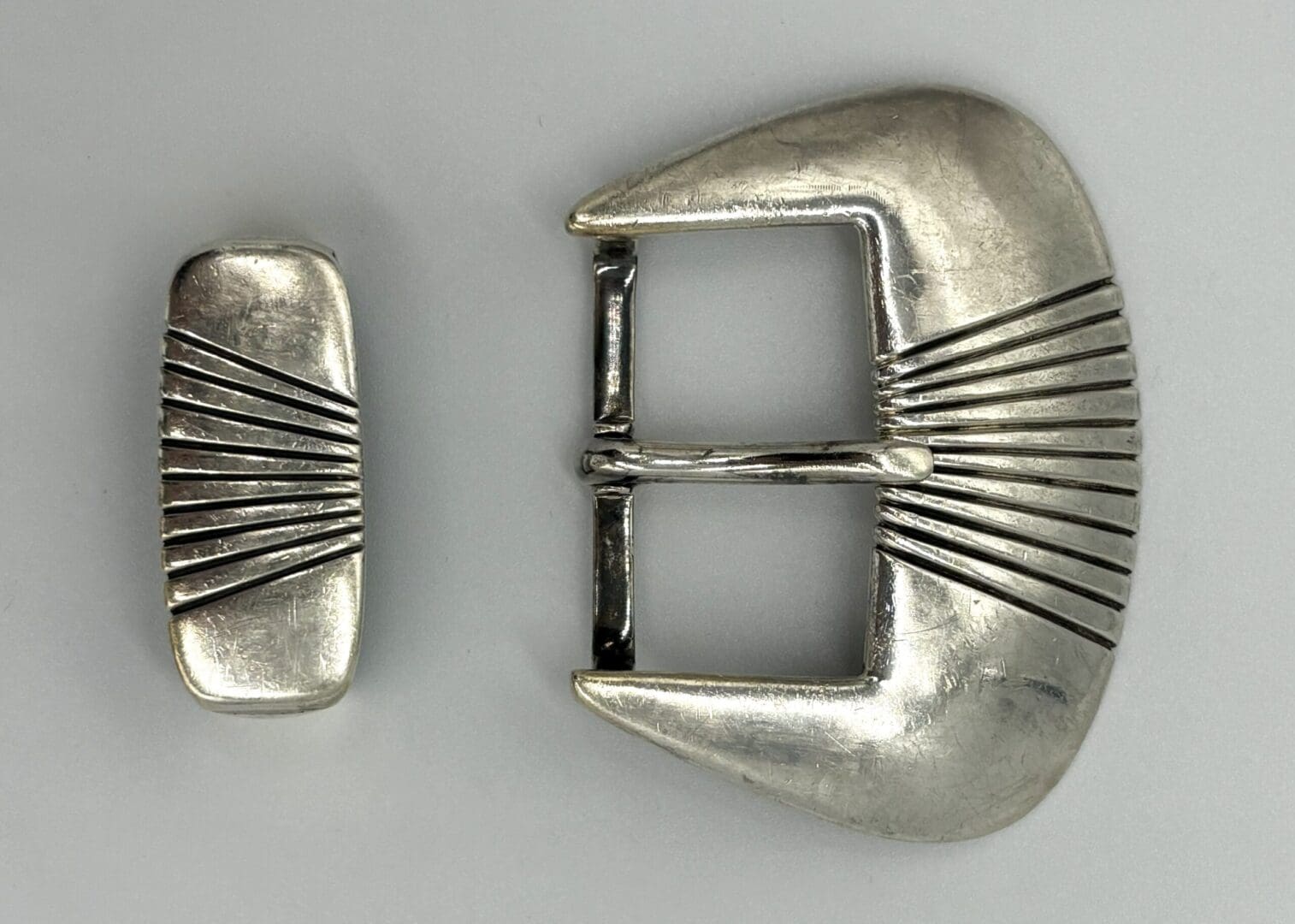 Silver belt buckle and matching clasp set.