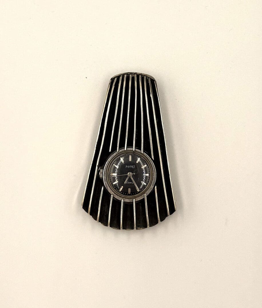Art deco style black and silver brooch.
