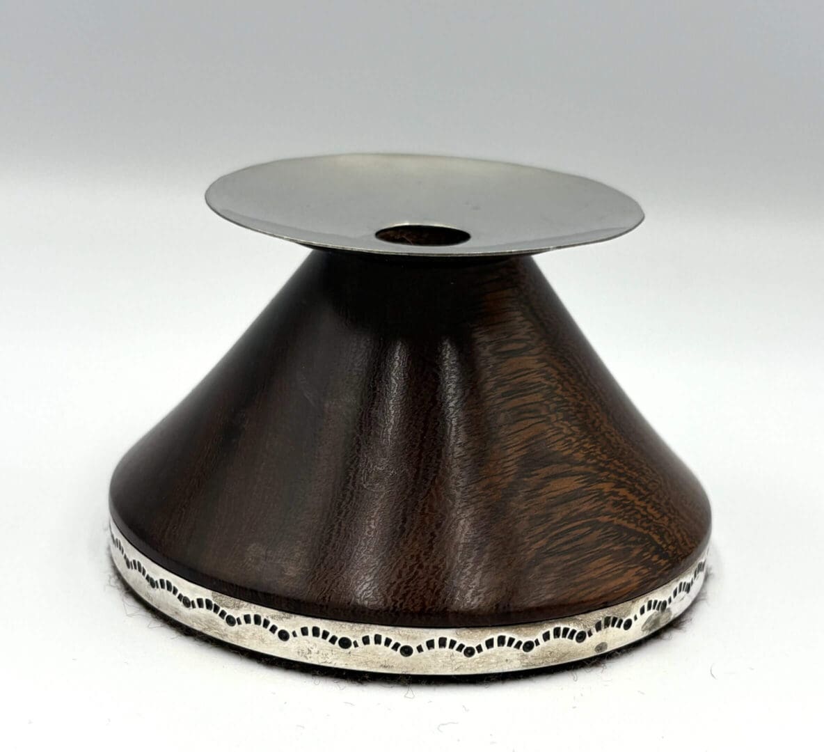 Wooden and metal cone-shaped object.