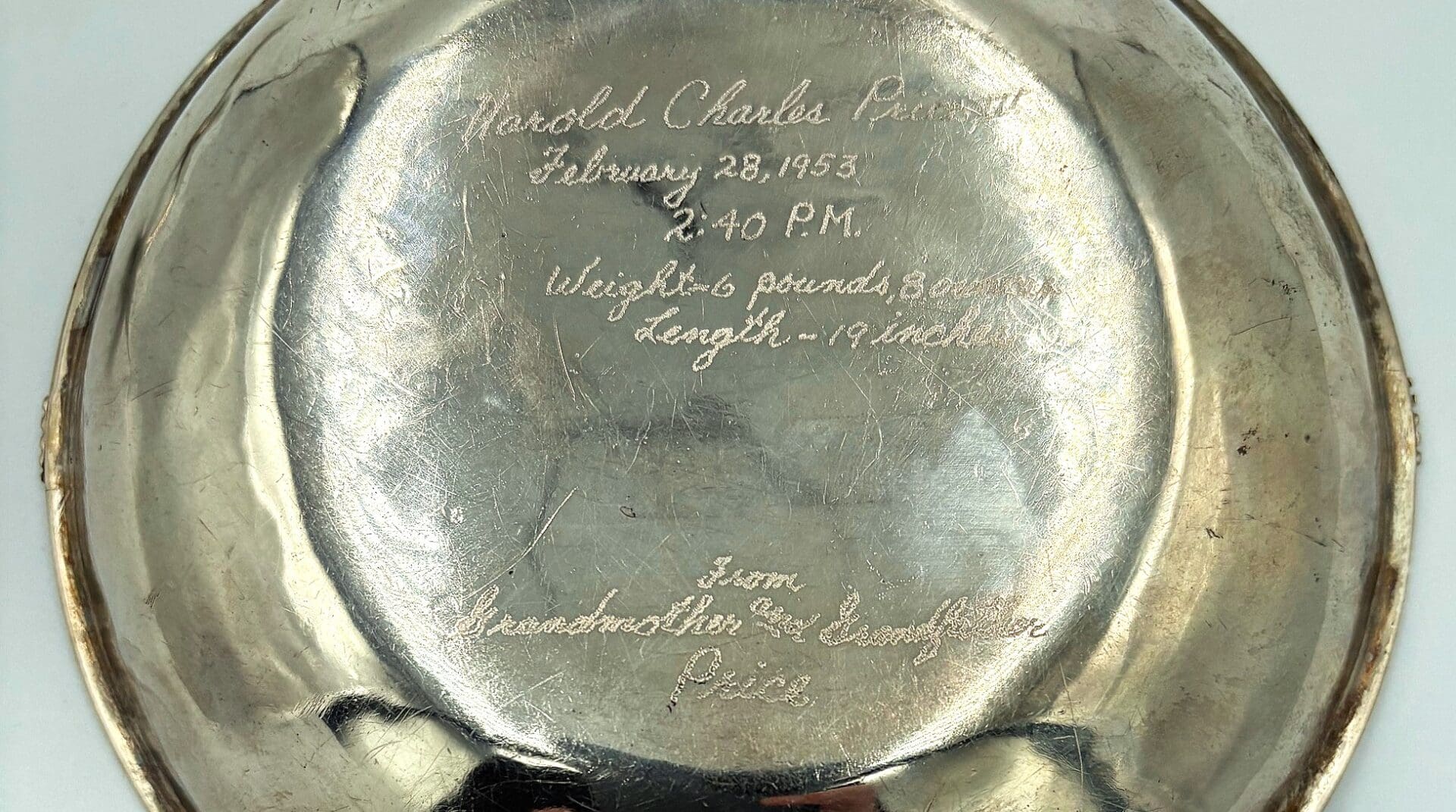 Engraved silver plate with personal inscription.