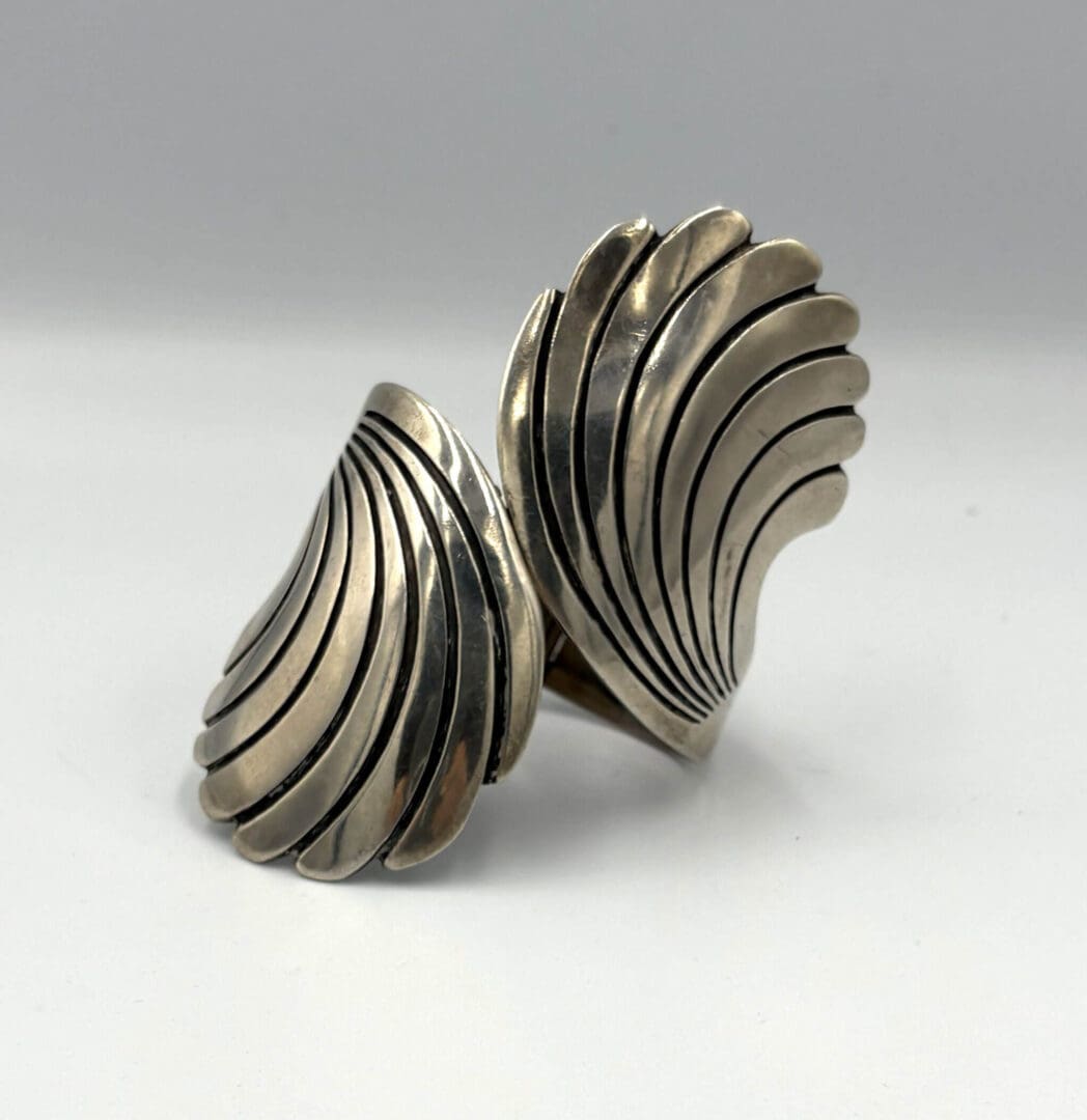 Silver shell-shaped statement ring design.