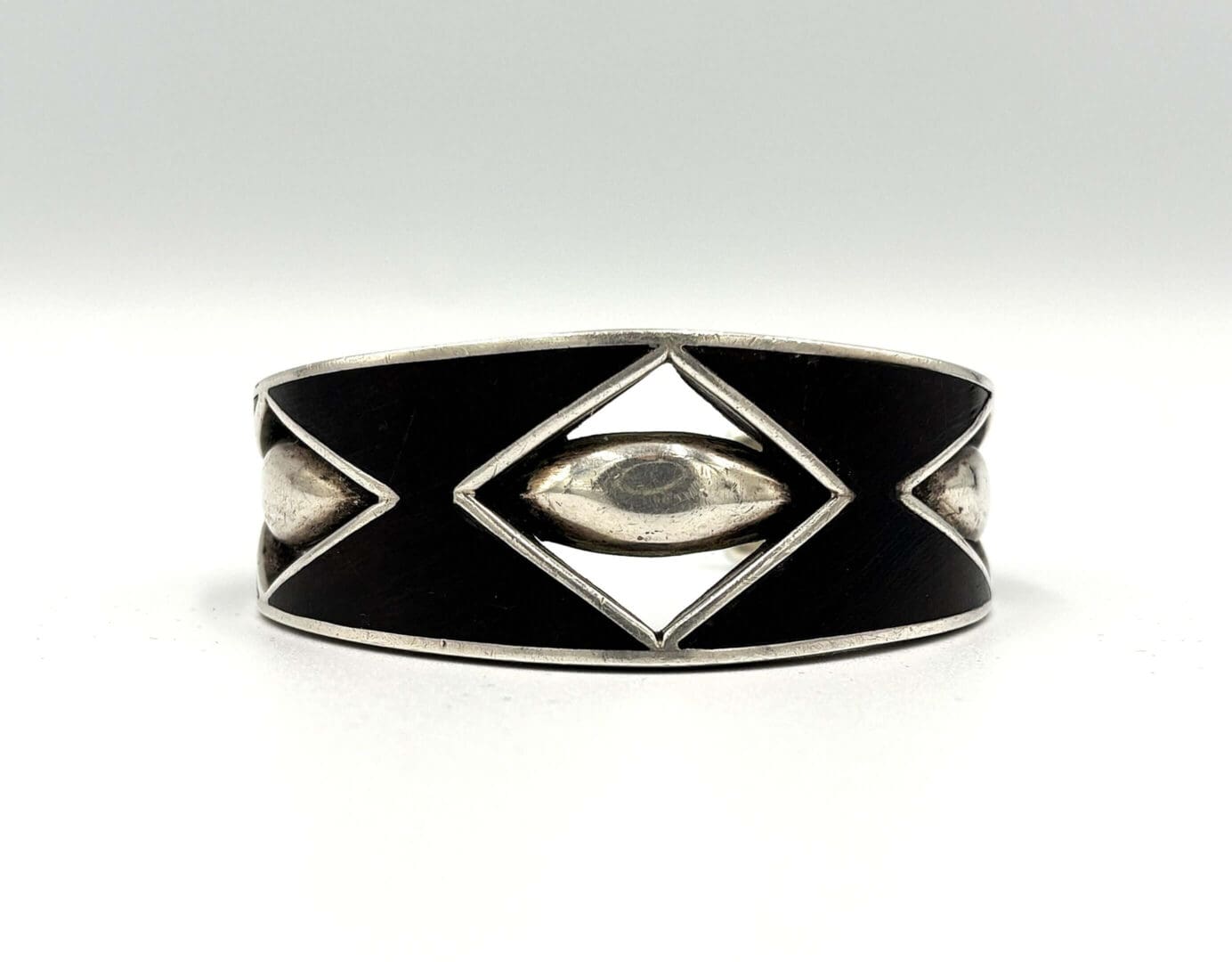 Silver and black geometric patterned bracelet.