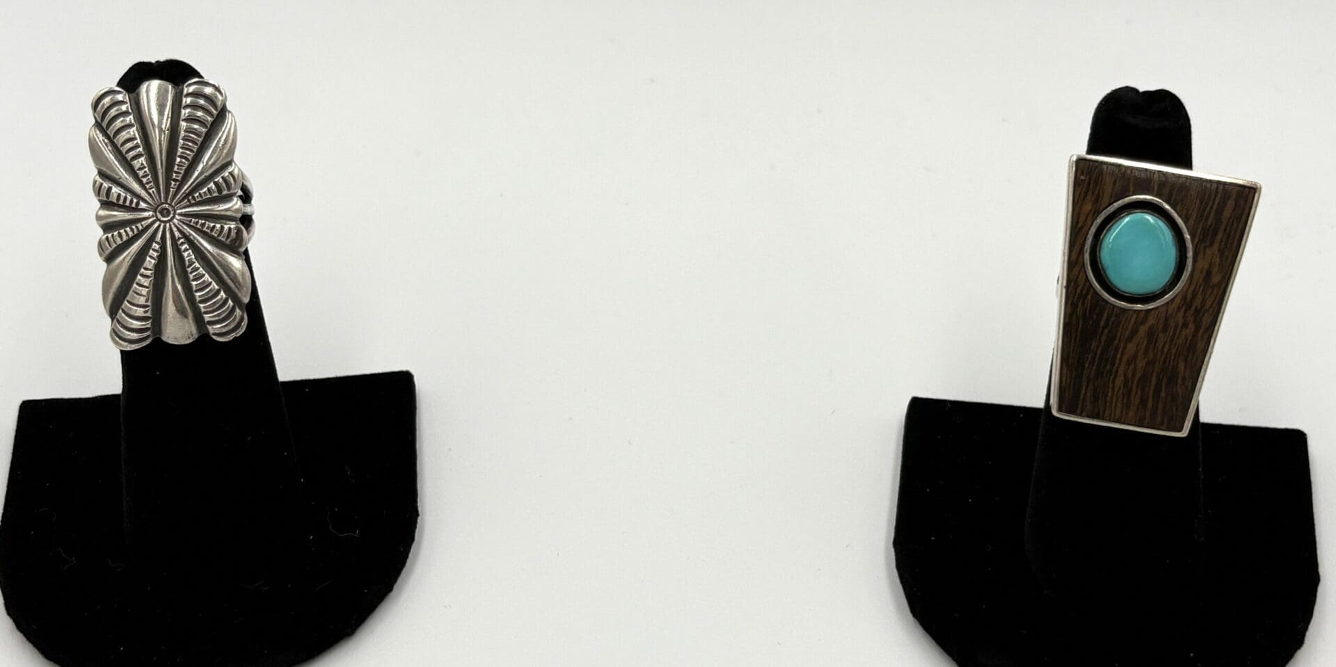 Two rings with distinct designs displayed.
