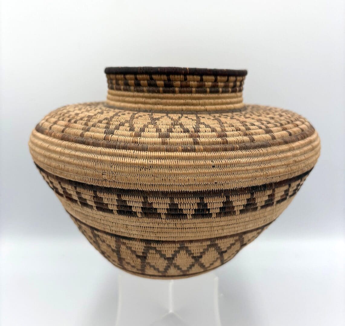 Woven basket with intricate geometric patterns.
