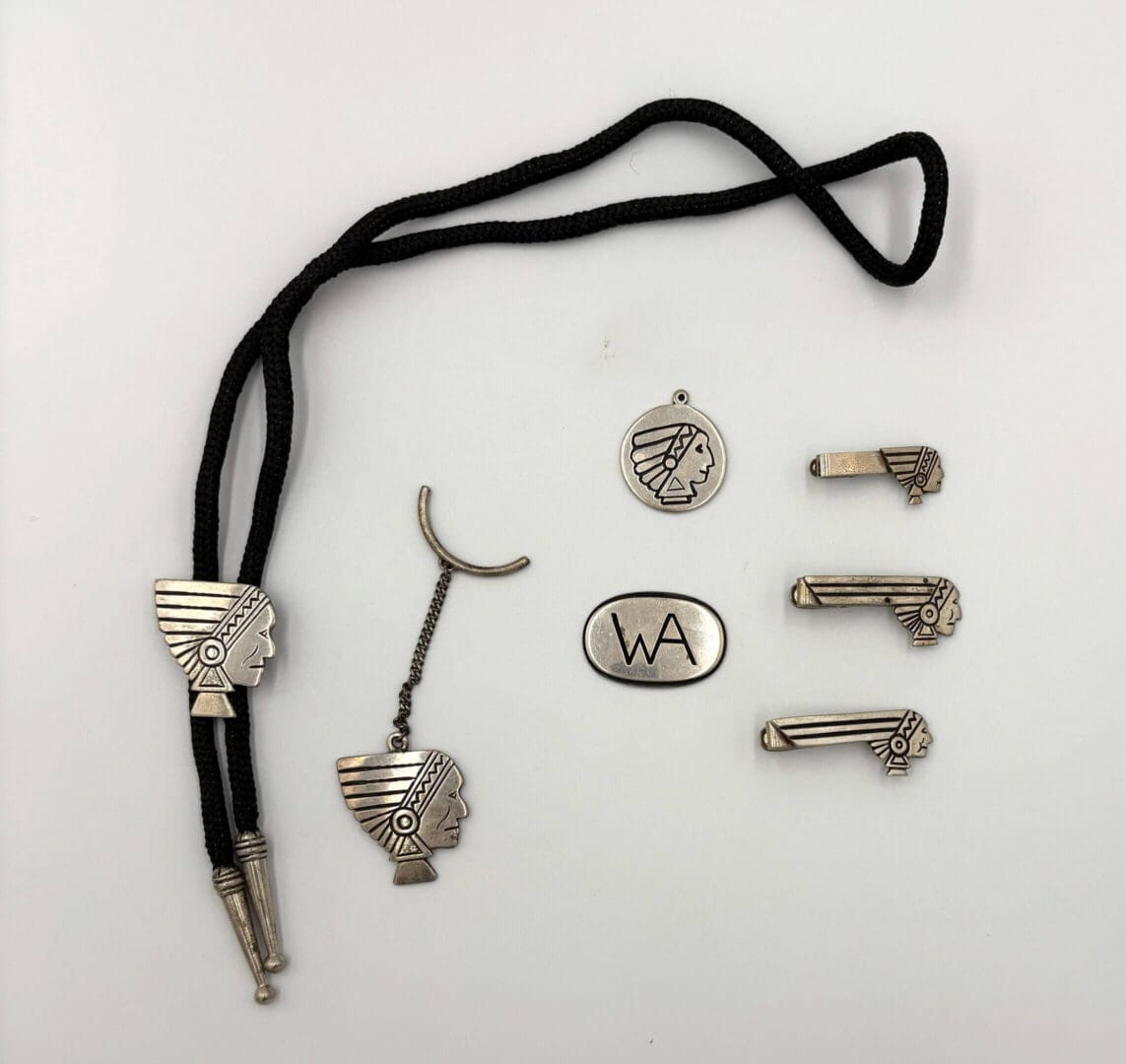 Western-themed jewelry set with bolo tie.