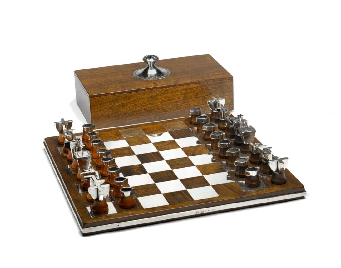 Wooden chess set with unique metal pieces.