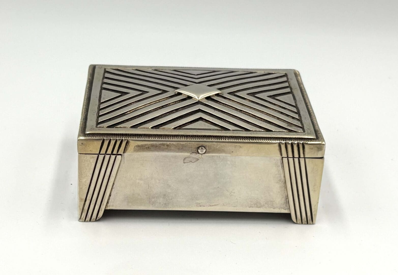 Silver geometric patterned rectangular box.
