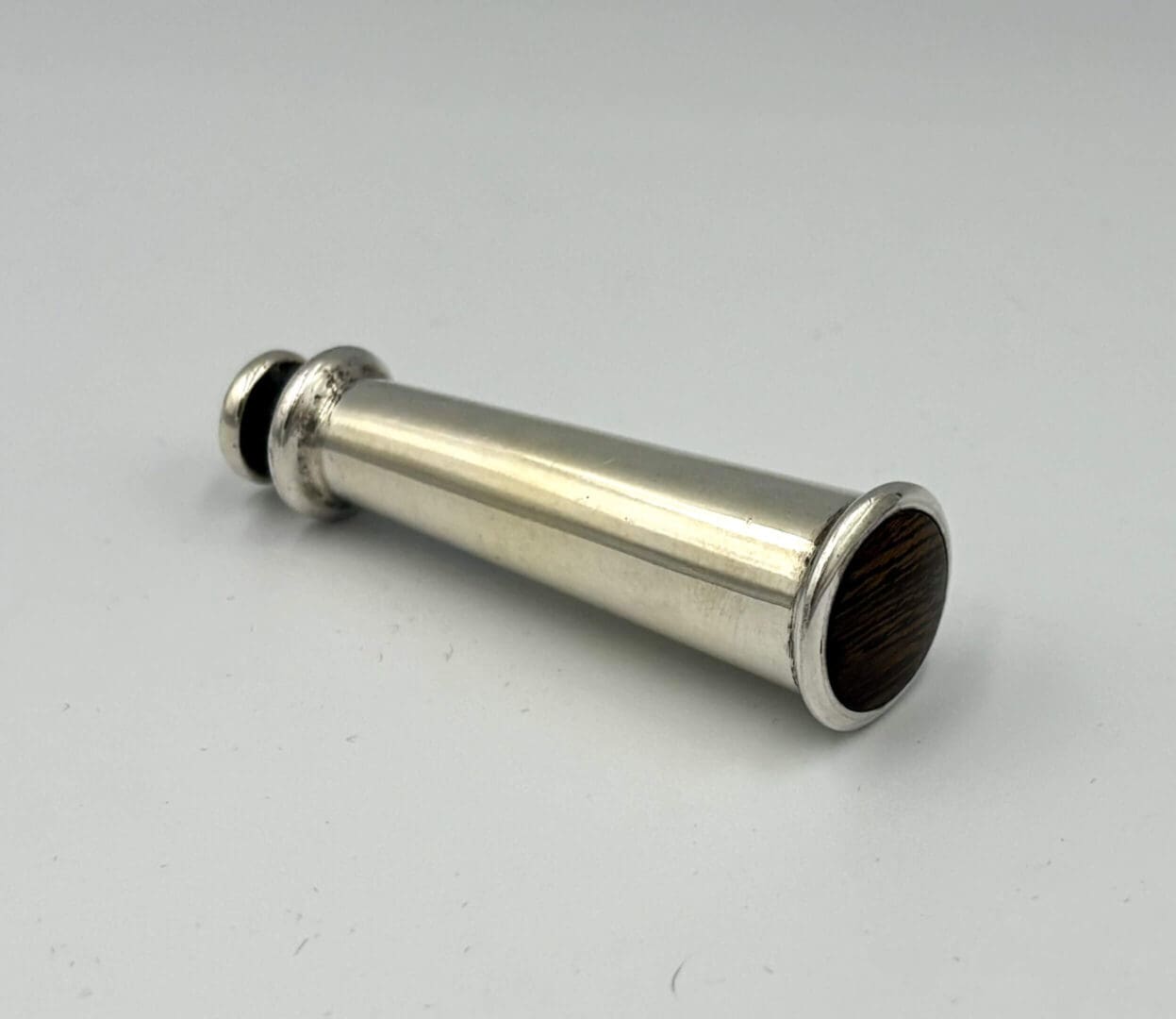 Silver vintage ear trumpet on white background.