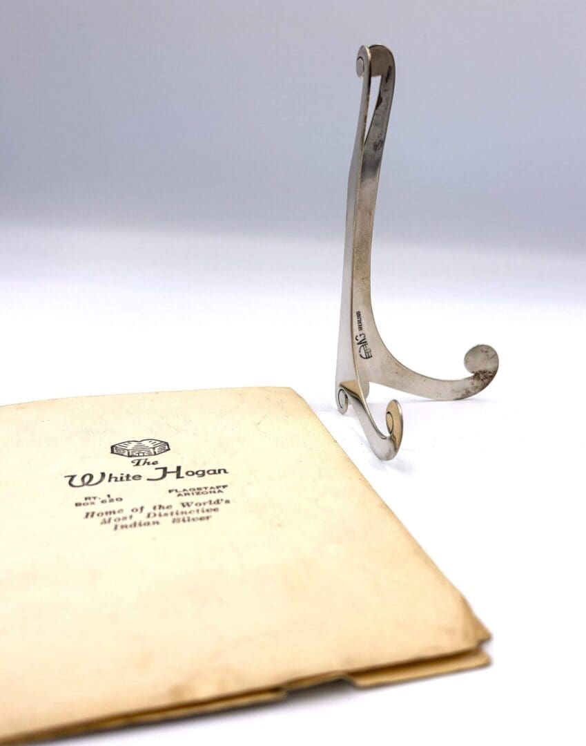 Silver stand and White Hogan booklet displayed.