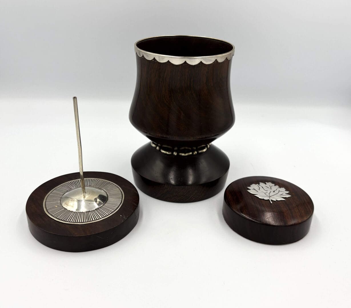 Wooden mate set with silver details.