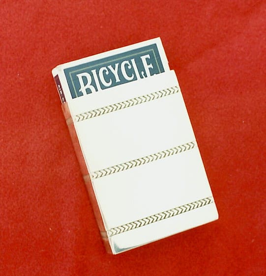 Playing cards in a white box.