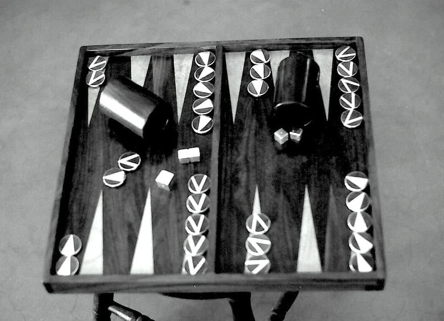 Backgammon board with pieces and dice.