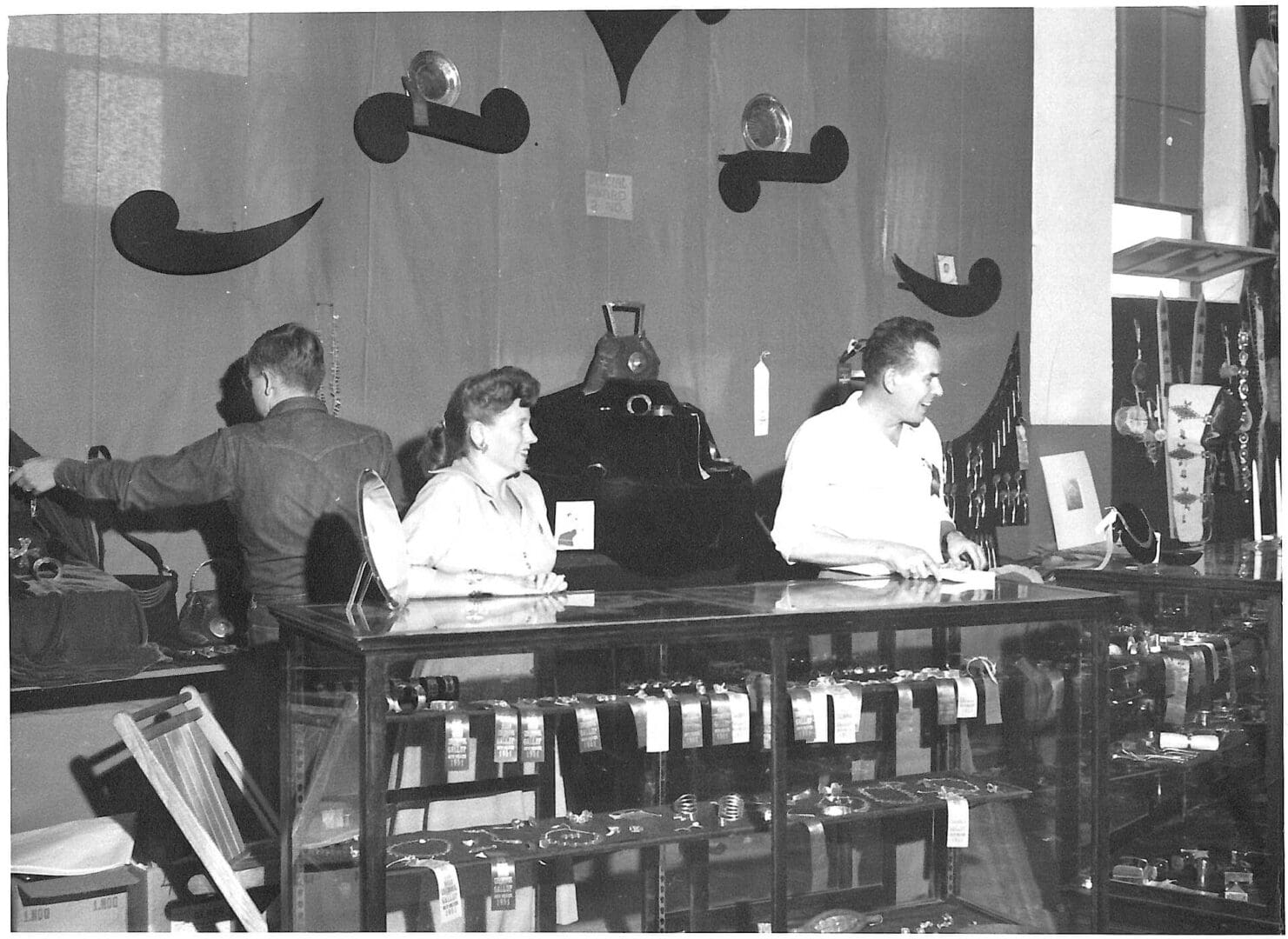 People working in a vintage store setting.